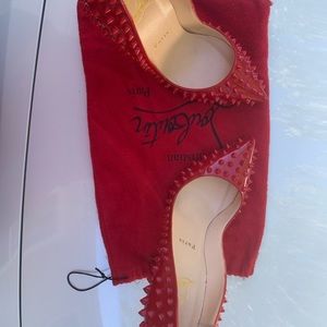 Red, Spiked, Christian Louboutin, never worn. Only tried on.